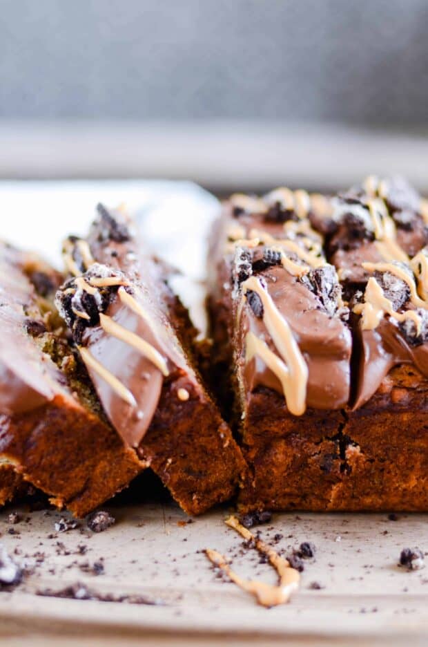 Triple the peanut butter in this sweet banana bread with a decadent cookies & cream packed ganache on top!