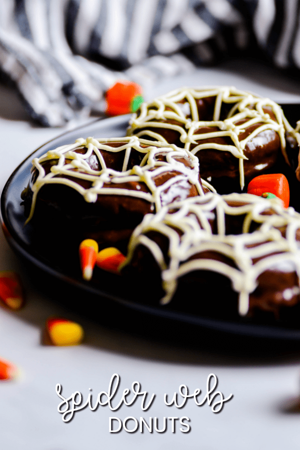 Double chocolate donuts with easy spider webs on top for Halloween!